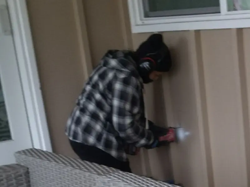 Professional electrician installing an exterior outlet in Paradise