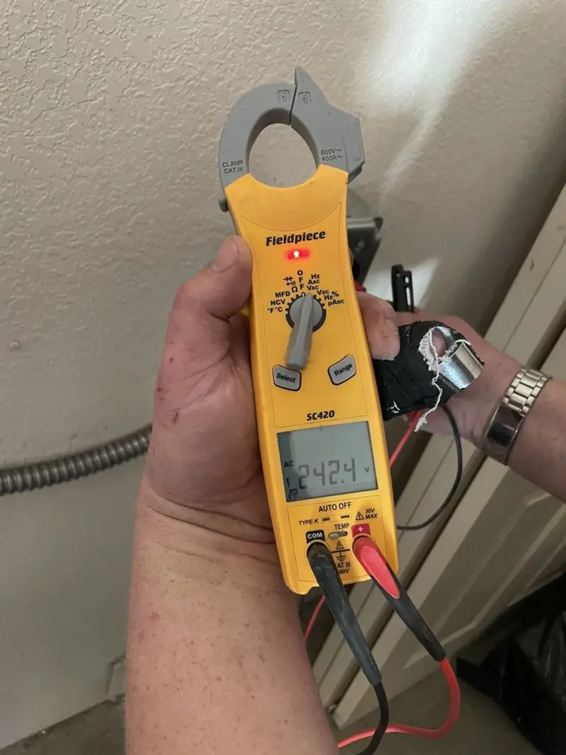 Voltage testing with clamp meter during Electrical Installation Services in Paradise